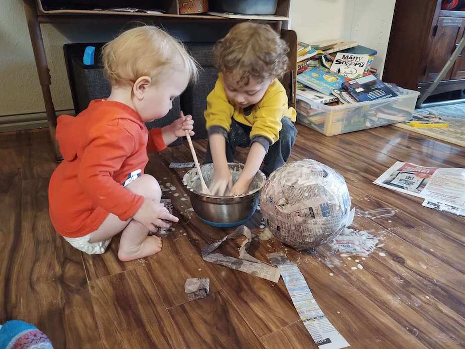 kids crafting with paper mache
